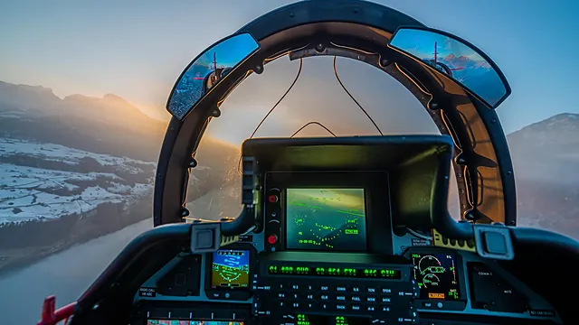 Twin Airparts mirrors mounted on the canopy bow at dusk, reflecting the terrain behind.